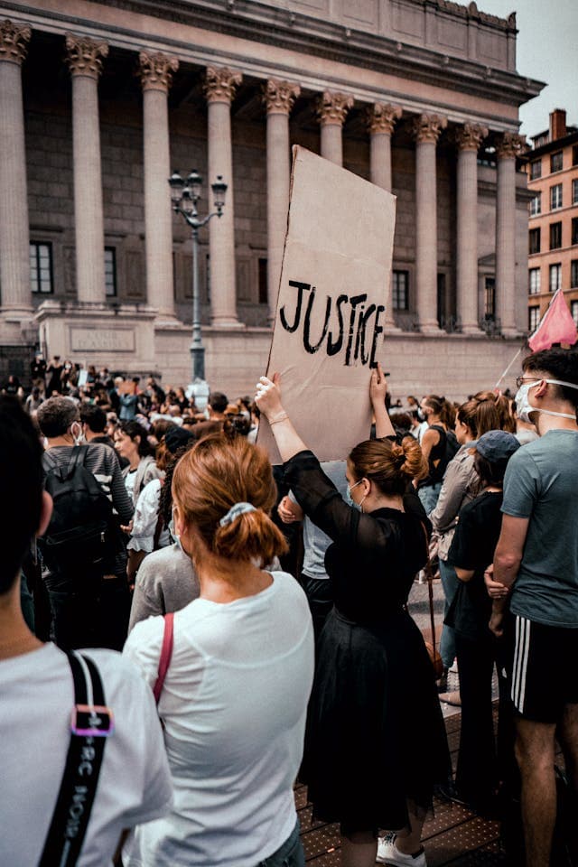 Woman holding justic sign